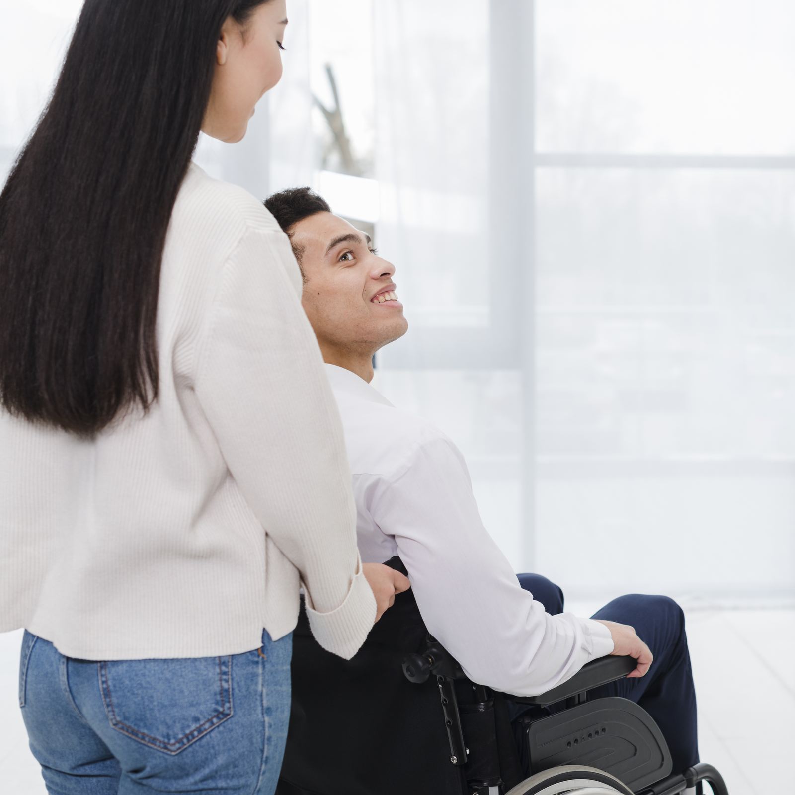A caregiver smiling with a client at home
